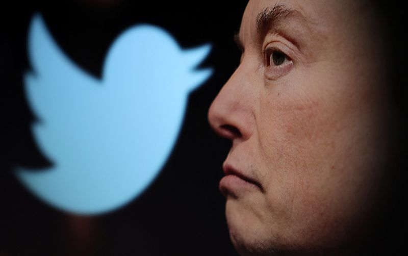 &copy; Reuters. Twitter logo and a photo of Elon Musk are displayed through magnifier in this illustration taken October 27, 2022. REUTERS/Dado Ruvic/Illustration
