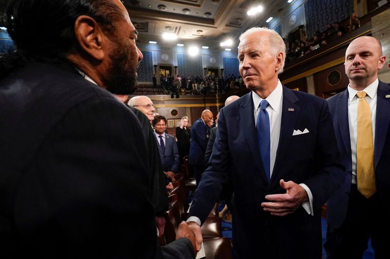 &copy; Reuters. FILE PHOTO: President Joe Biden shakes hands with Rep. Al Green, D-Texas, after the State of the Union address to a joint session of Congress at the Capitol, Tuesday, Feb. 7, 2023, in Washington.   Jacquelyn Martin/Pool via REUTERS/File Photo