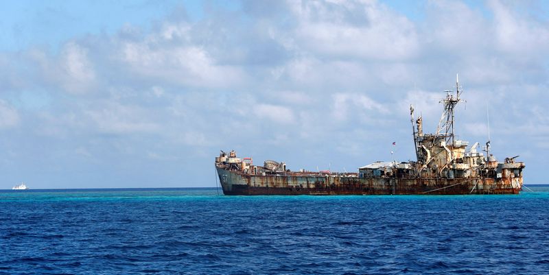 &copy; Reuters. FILE PHOTO: A Chinese Coastguard vessel patrols near the BRP Sierra Madre, a marooned transport ship which Philippine Marines live on as a military outpost, in the disputed Second Thomas Shoal, part of the Spratly Islands in the South China Sea March 30, 