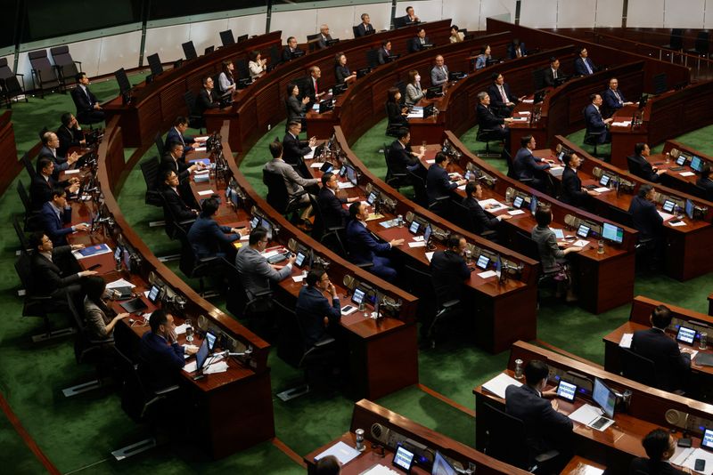 &copy; Reuters. Legislators vote for the third reading of the District Councils (Amendment) Bill, which pertains to electoral overhaul, at the Legislative Council in Hong Kong, China July 6, 2023. REUTERS/Tyrone Siu