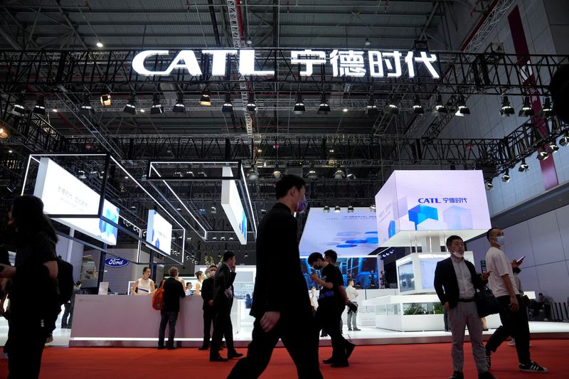 &copy; Reuters. FILE PHOTO: People walk past the booth of the battery manufacturer Contemporary Amperex Technology Co. Limited (CATL) at the Auto Shanghai show, in Shanghai, China April 18, 2023. REUTERS/Aly Song/File Photo