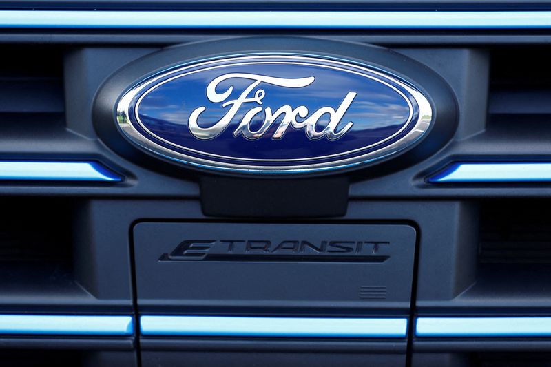 © Reuters. FILE PHOTO: The Ford badge and E-Transit logo are seen on a vehicle at Ford’s Dunton Technical Centre in Dunton, Britain, January 13, 2023.  REUTERS/Peter Nicholls/File Photo