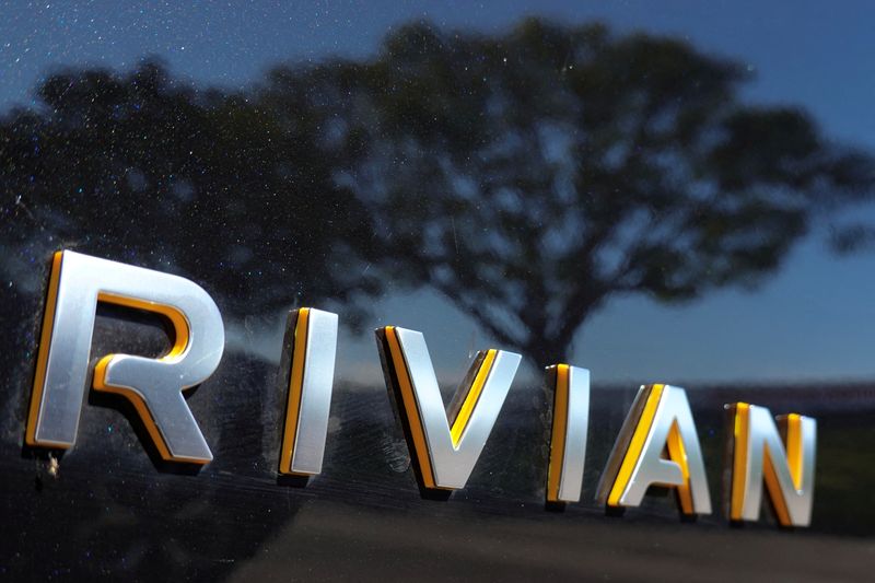 &copy; Reuters. FILE PHOTO: The Rivian name is shown on one of their new electric SUV vehicles in San Diego, U.S., December 16, 2022. REUTERS/Mike Blake/File Photo