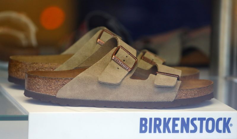 &copy; Reuters. FILE PHOTO: A pair of shoes is pictured in a window of a Birkenstock footwear store in Berlin, Germany, January 21, 2021. REUTERS/Fabrizio Bensch/File Photo