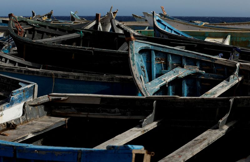 © Reuters. Dozens of wooden boats used by migrants to reach the Canary Islands are seen at the Port of Arinaga, in the island of Gran Canaria, Spain, June 7, 2022. Picture taken June 7, 2022. REUTERS/Borja Suarez/File Photo