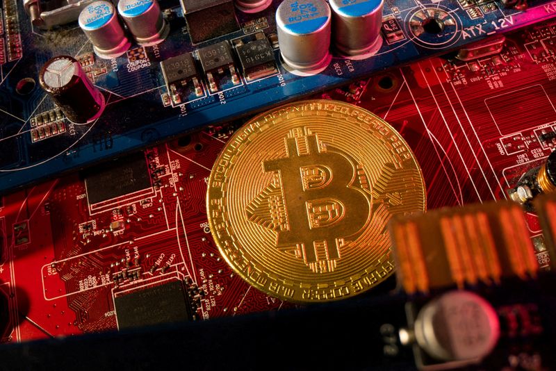 &copy; Reuters. FILE PHOTO: A representation of cryptocurrency Bitcoin is placed on a PC motherboard, in this illustration taken June 16, 2023. REUTERS/Dado Ruvic/Illustration/File Photo