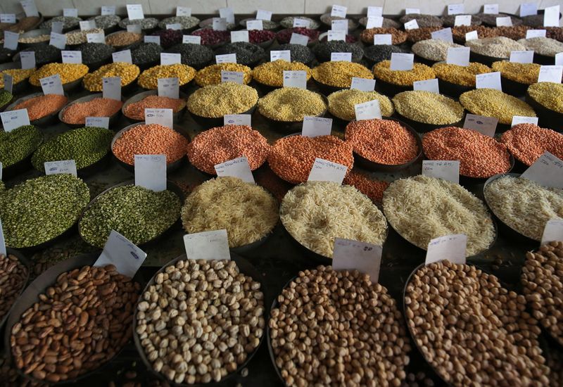 &copy; Reuters. FILE PHOTO-Price tags are seen on the samples of rice and lentils that are kept on display for sale at a wholesale market in the old quarters of Delhi, India, June 7, 2018. REUTERS/Amit Dave/file photo