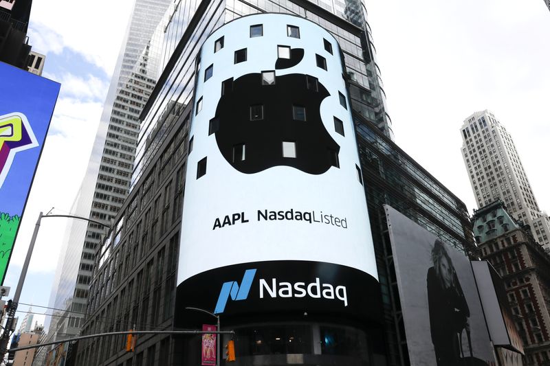 &copy; Reuters. FILE PHOTO: An electronic screen displays the Apple Inc. logo on the exterior of the Nasdaq Market Site following the close of the day's trading session in New York City, New York, U.S., August 2, 2018. REUTERS/Mike Segar/File Photo