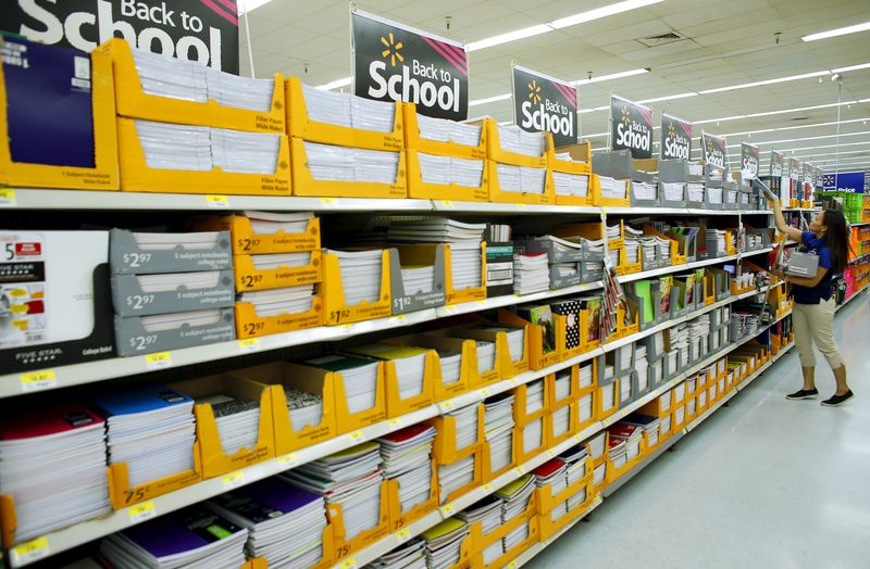 &copy; Reuters. Walmart department manager Karren Gomes helps stock shelves with school supplies as the retail store prepare for back to school shoppers in San Diego, California August 6, 2015. REUTERS/Mike Blake/File Photo