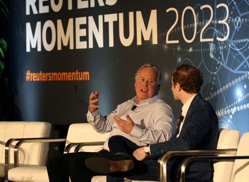 © Reuters. Bradley Peterson, EVP, chief information and technology officer for Nasdaq, left, answers questions from Reuters correspondent Jeffrey Dastin during the Reuters MOMENTUM event, held to discuss the development and use of AI in Austin, Texas, U.S. July 11, 2023.  REUTERS/Nuri Vallbona