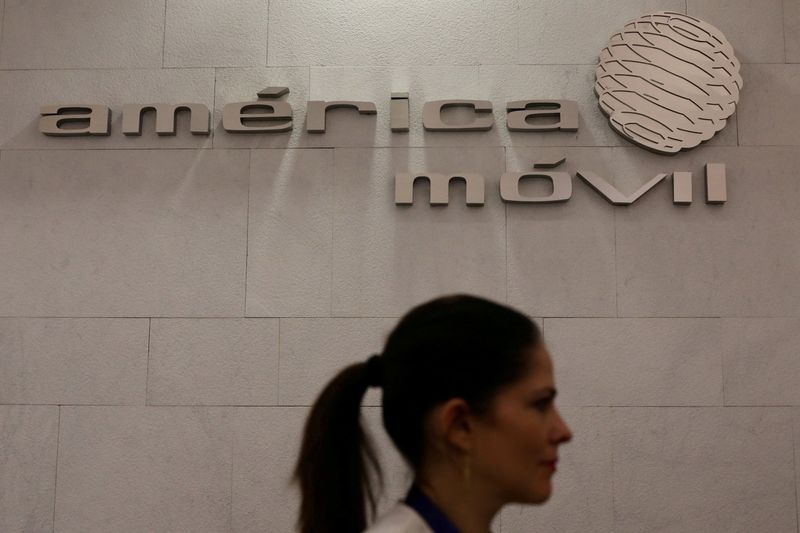 &copy; Reuters. FILE PHOTO: The logo of America Movil is pictured on the wall of a reception area in the company's corporate offices in Mexico City, Mexico, May 18, 2017. REUTERS/Edgard Garrido/File Photo