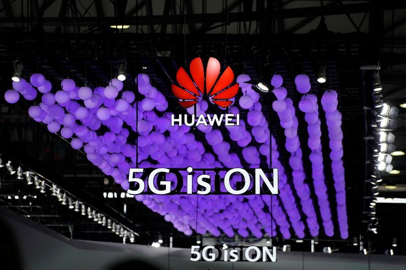 &copy; Reuters. A Huawei logo and a 5G sign are pictured at Mobile World Congress (MWC) in Shanghai, China June 28, 2019. REUTERS/Aly Song