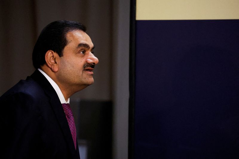 &copy; Reuters. FILE PHOTO: Indian billionaire Gautam Adani speaks during an inauguration ceremony after the Adani Group completed the purchase of Haifa Port earlier in January 2023, in Haifa port, Israel January 31, 2023. REUTERS/Amir Cohen/File Photo