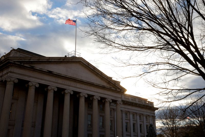 &copy; Reuters. FILE PHOTO: The American flag flies over the U.S. Treasury building in Washington, U.S., January 20, 2023.  REUTERS/File Photo