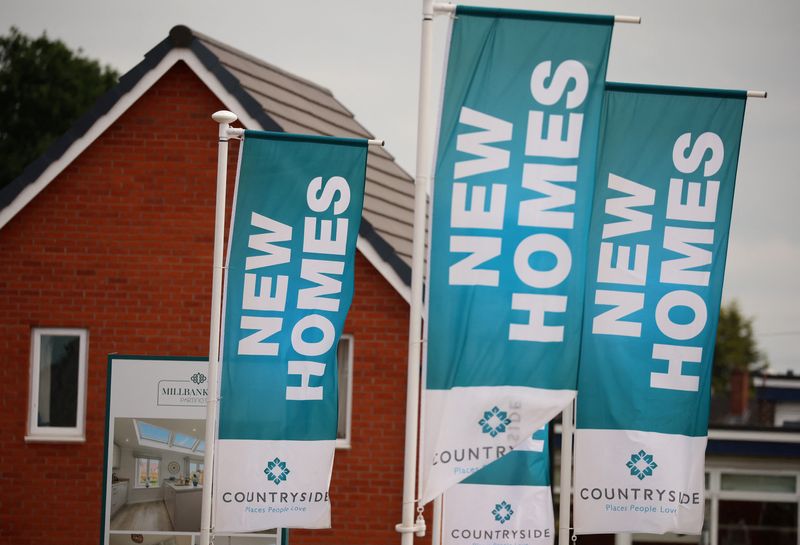 &copy; Reuters. Banners advertising new houses for sale a seen on a new housing development under construction in Partington, Britain June 1, 2023. REUTERS/Phil Noble/File Photo