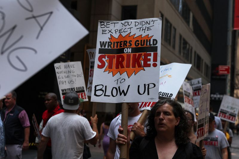 &copy; Reuters. Striking Writers Guild of America (WGA) members walk the picket line as SAG-AFTRA union announced it had agreed to a 'last-minute request' by the Alliance of Motion Picture and Television Producers for federal mediation, but it refused to again extend its