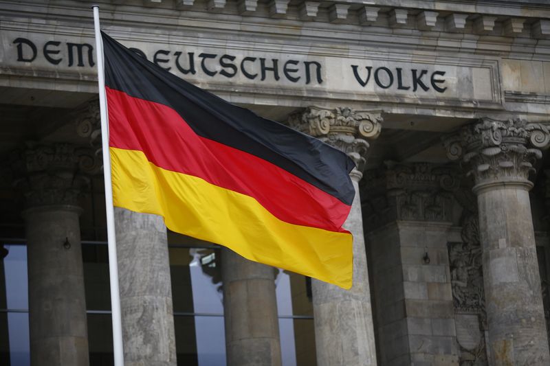 &copy; Reuters. FILE PHOTO-German flag is seen outside the German lower house of parliament Bundestag before the election of a new chancellor in Berlin, Germany, March 14, 2018. REUTERS/Hannibal Hanschke/file photo