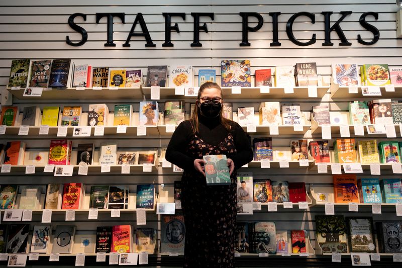 © Reuters. FILE PHOTO: A supervisor at the Doylestown Bookshop holds a copy of 