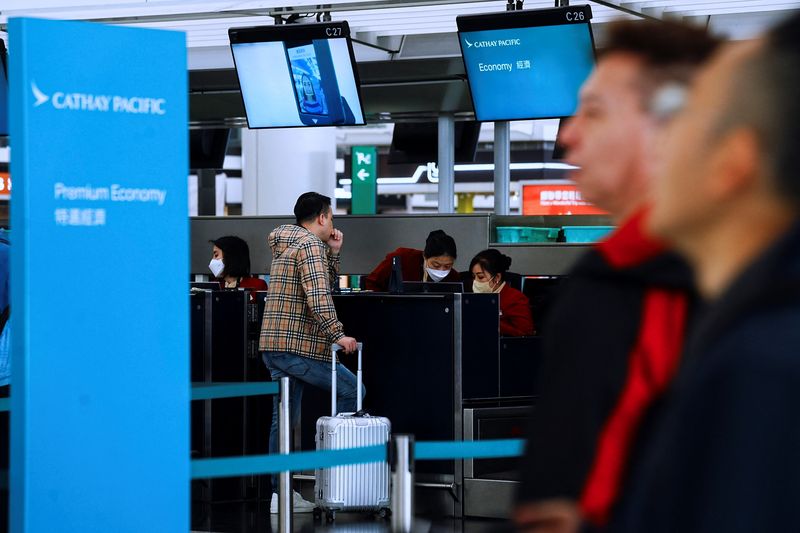 &copy; Reuters. FILE PHOTO: Cathay Pacific employees work at Hong Kong International Airport, in Hong Kong, China March 8, 2023. REUTERS/Lam Yik