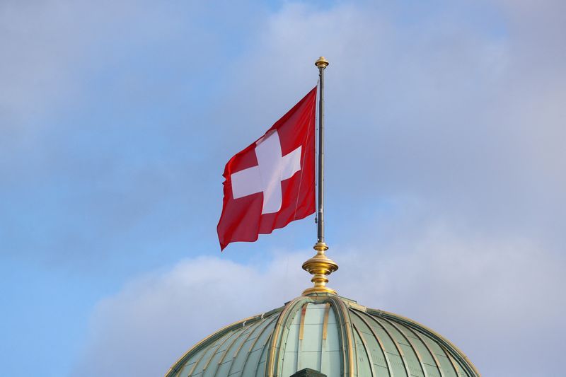 &copy; Reuters. FILE PHOTO: The flag of Switzerland flies on the dome of the Parliament Building (Bundeshaus), in Bern, Switzerland October 28, 2020. REUTERS/Arnd Wiegmann/File Photo