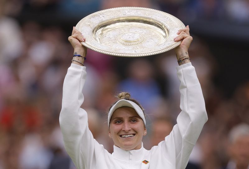 &copy; Reuters. Tennis - Wimbledon - All England Lawn Tennis and Croquet Club, London, Britain - July 15, 2023 Czech Republic's Marketa Vondrousova celebrates with the trophy winning her final match against Tunisia’s Ons Jabeur REUTERS/Andrew Couldridge