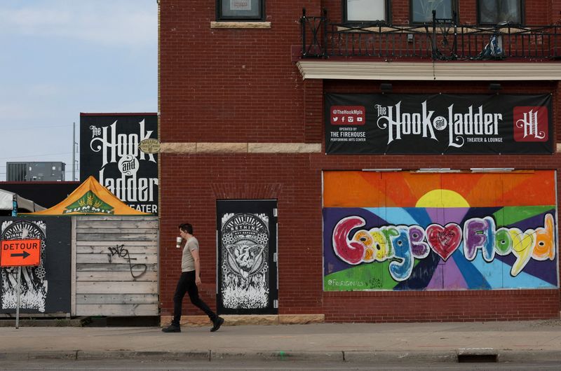 &copy; Reuters. FILE PHOTO: A pedestrian walks past a mural near the closed Minneapolis 3rd Police Precinct on the third anniversary of the murder of George Floyd by a police officer in Minneapolis, Minnesota, U.S., May 25, 2023. REUTERS/Leah Millis/File Photo