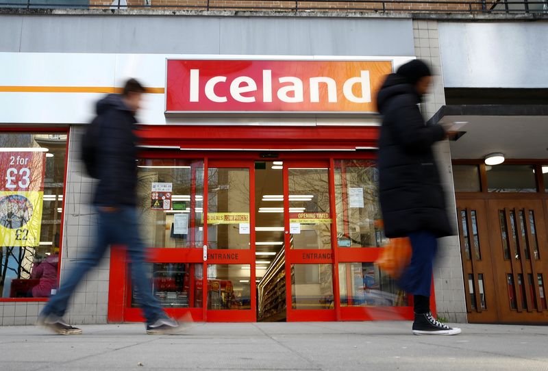 &copy; Reuters. FILE PHOTO: People walk past an Iceland store in London, Britain. Picture taken March 2, 2020. REUTERS/Henry Nicholls/File Photo