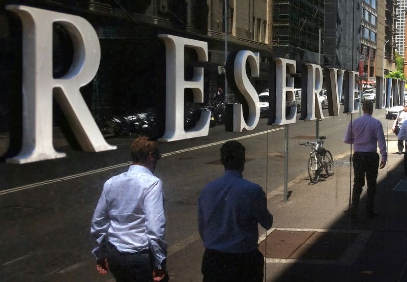 &copy; Reuters. FILE PHOTO: Pedestrians walk past the Reserve Bank of Australia building in central Sydney, Australia, February 10, 2017. REUTERS/Steven Saphore/