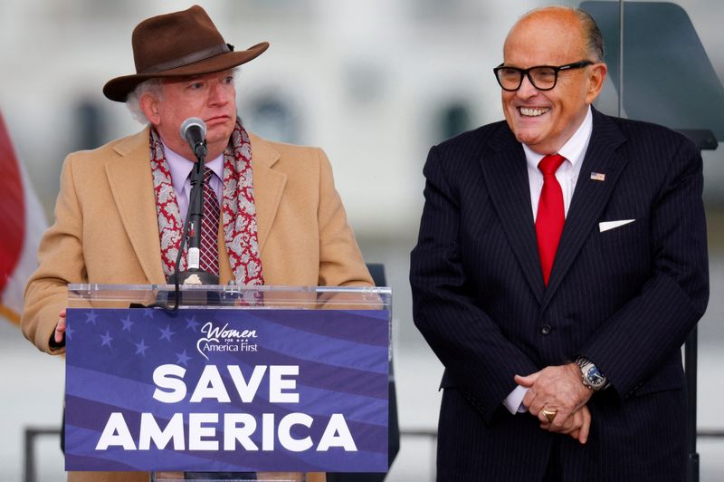 © Reuters. FILE PHOTO: Attorney John Eastman speaks next to U.S. President Donald Trump's personal attorney Rudy Giuliani, as Trump supporters gather ahead of the president’s speech to contest the certification by the U.S. Congress of the results of the 2020 U.S. presidential election on the Ellipse in Washington, U.S, January 6, 2021. Picture taken January 6, 2021. REUTERS/Jim Bourg/File Photo