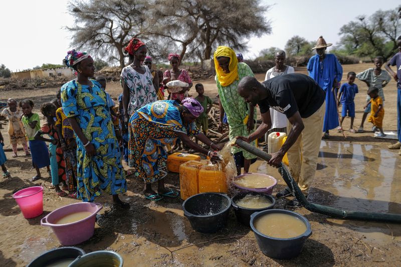 From pixels to pails, crowdfunded wells quench thirst in Senegal's drylands