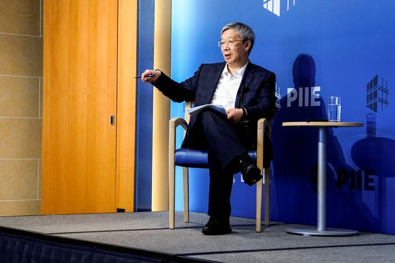 &copy; Reuters. FILE PHOTO: Governor of the Peoples Bank of China, Yi Gang speaks to the media at the Peterson Institute for International Economics, (PIIE), in Washington, D.C., U.S. April 15, 2023. REUTERS/Ken Cedeno