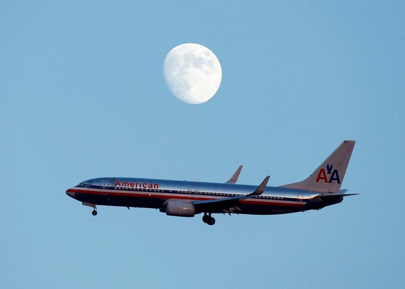 &copy; Reuters. FILE PHOTO: An American Airlines passenger jet glides in under the moon as it lands at LaGuardia airport in New York, New York, August 28, 2012. REUTERS/Eduardo Munoz/File Photo