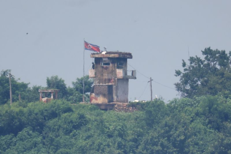 © Reuters. A North Korean soldier stands guard at their guard post in this picture taken near the demilitarized zone separating the two Koreas, in Paju, South Korea July 19, 2023.   REUTERS/Kim Hong-Ji