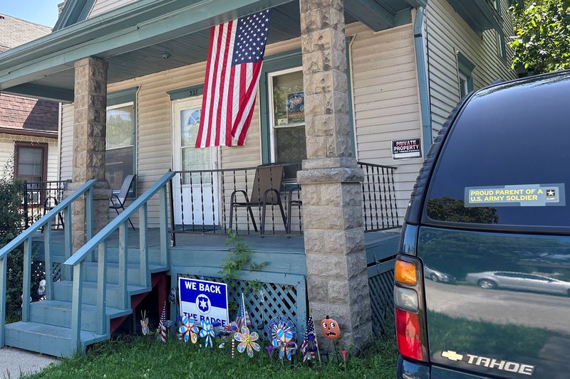 &copy; Reuters. A U.S. flag hangs on the porch and a "Proud parent of a U.S. Army soldier" sticker adorns the car outside the home of 23-year-old Private Travis King's mother in Racine, Wisconsin, U.S., July 19, 2023. REUTERS/Eric Cox
