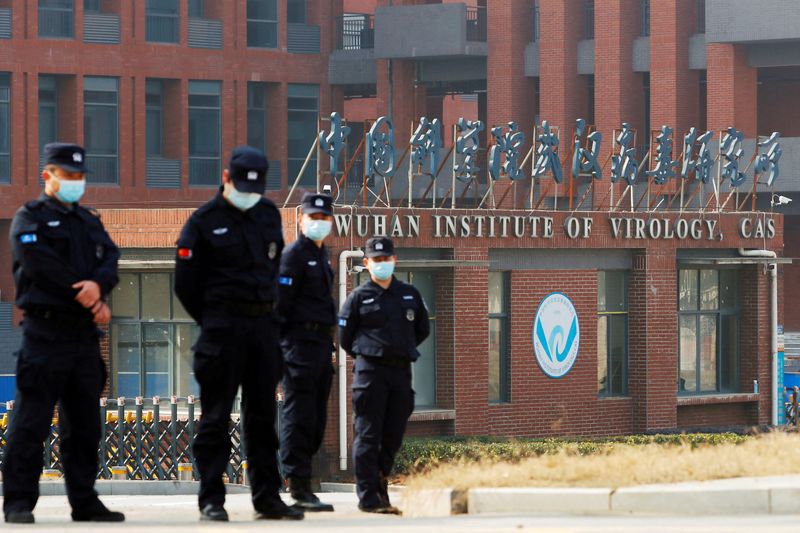 &copy; Reuters. FILE PHOTO: Security personnel keep watch outside Wuhan Institute of Virology during the visit by the World Health Organization (WHO)  team tasked with investigating the origins of the coronavirus disease (COVID-19), in Wuhan, Hubei province, China Febru