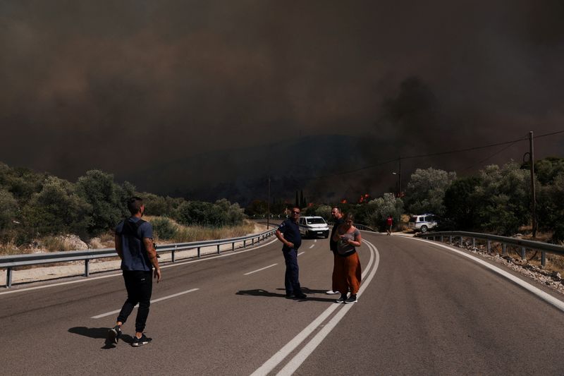 Wildfires in Greece largely contained, new heatwave looms