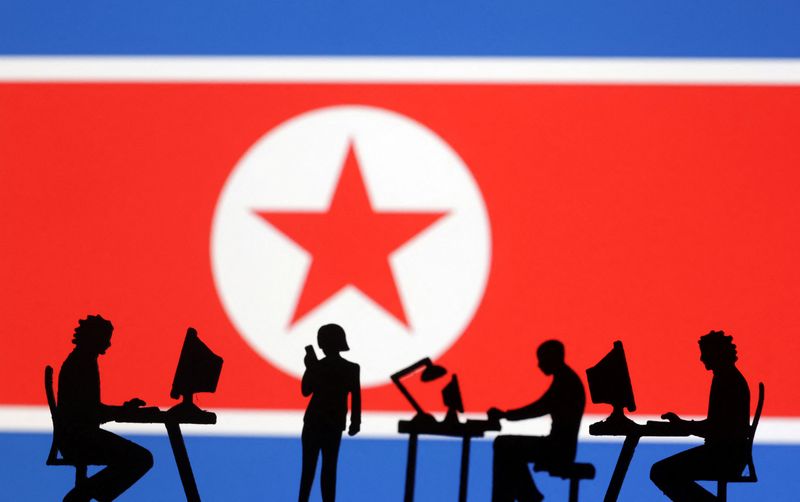 &copy; Reuters. Miniatures of people with computers are seen in front of North Korea flag in this illustration taken July 19, 2023. REUTERS/Dado Ruvic/Illustration