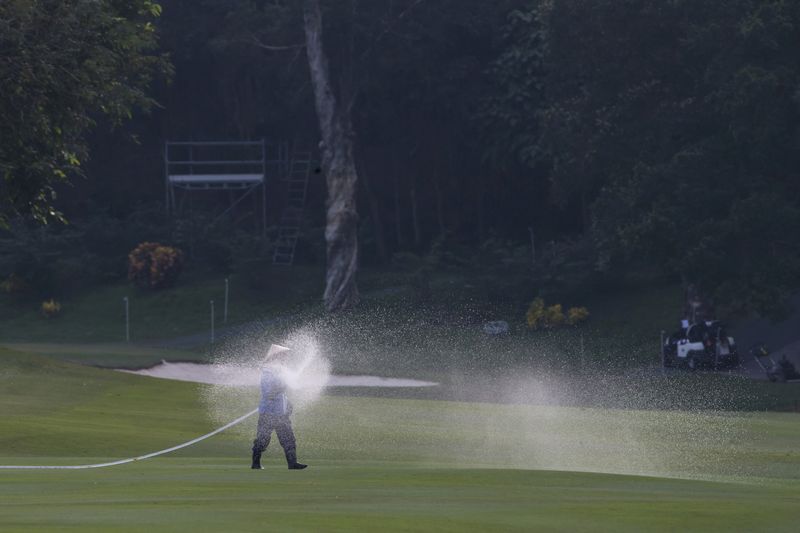 &copy; Reuters. FILE PHOTO: A course worker sprays water on the fairway at the Hong Kong Golf Club, in Hong Kong, China October 22, 2015. REUTERS/Tyrone Siu