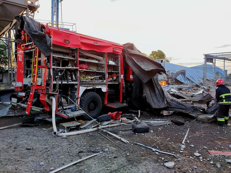 &copy; Reuters. A rescue worker stands next to a heavily damaged emergency vehicle at a compound of an agricultural company hit by a Russian missile strike, amid Russia's attack, on Ukraine in Odesa region, Ukraine July 21, 2023. Press service of the State Emergency Serv