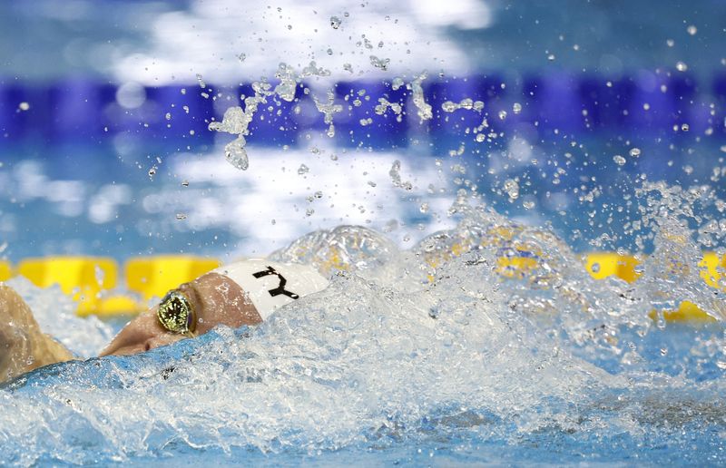 Swimming-French torpedo Marchand smashes Phelps' 15-year record at worlds