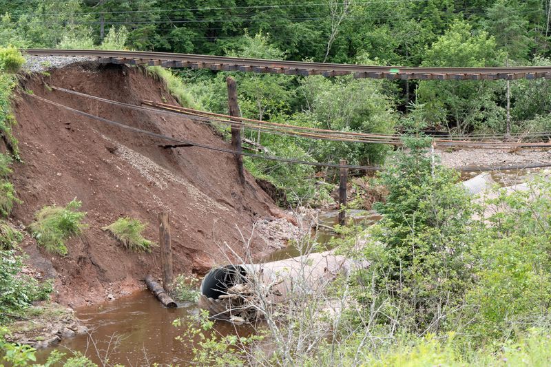 &copy; Reuters. The main CN Rail line which leads to the port of Halifax is suspended over a washed-out culvert, after the heaviest rain to hit the Atlantic Canadian province of Nova Scotia in more than 50 years triggered floods, in Truro, Nova Scotia, Canada July 23, 20