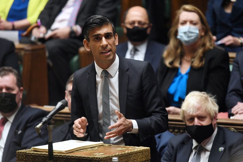 &copy; Reuters. FILE PHOTO: Britain's Chancellor of the Exchequer Rishi Sunak, flanked by Britain's Prime Minister Boris Johnson, addresses lawmakers during a session on the budget at the Parliament, in London, Britain October 27, 2021. UK Parliament/Jessica Taylor/Hando