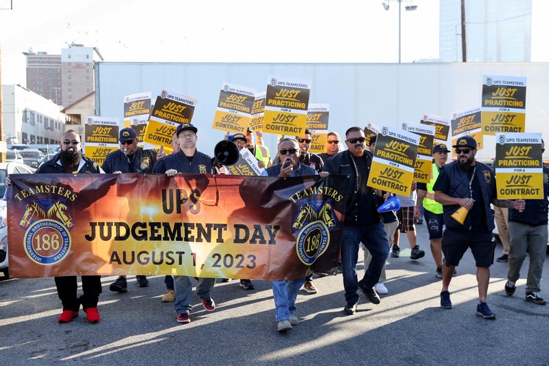 &copy; Reuters. FILE PHOTO: Teamsters employed by UPS hold a rally outside a UPS facility in downtown L.A. as an August 1st strike deadline against the company nears in Los Angeles, California, U.S. July 19, 2023. REUTERS/Mike Blake/File Photo