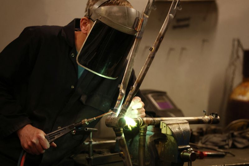 &copy; Reuters. A worker assembles a new bike frame at the Pashley bicycle factory in Stratford-upon-Avon, Britain, June 30, 2022. REUTERS/Phil Noble/File Photo