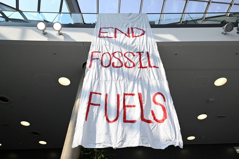 © Reuters. FILE PHOTO: A banner reads 