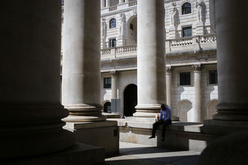 &copy; Reuters. A man reads his phone in front of the Bank of England in London's financial district, as Britain struggles with the highest inflation rate among the world's big rich economies, London, Britain, 17 July 2023. REUTERS/Rachel Adams