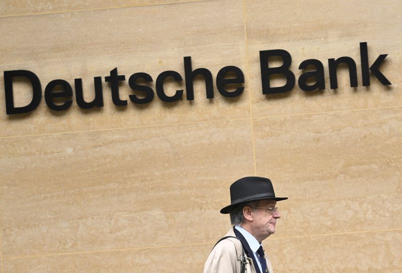 &copy; Reuters. A worker walks past Deutsche Bank offices in London, Britain, March 16, 2023. REUTERS/Toby Melville/File photo