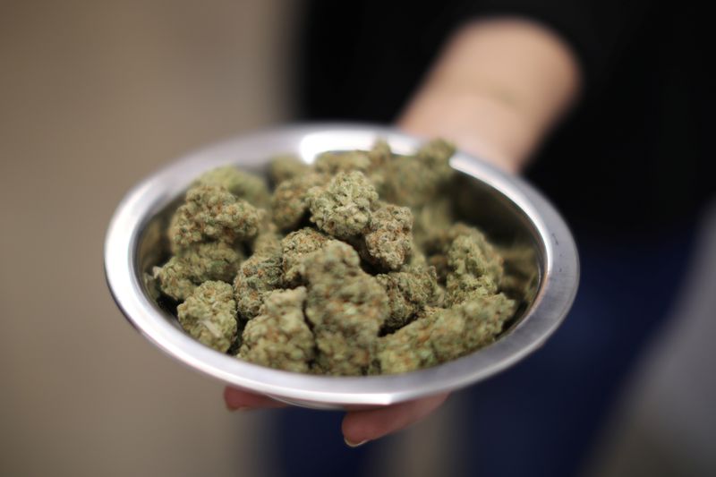 &copy; Reuters. A woman holds marijuana for sale at the MedMen store in West Hollywood, California U.S. January 2, 2018. REUTERS/Lucy Nicholson