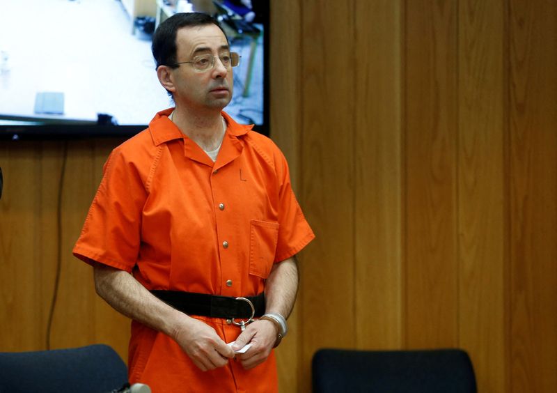 &copy; Reuters. FILE PHOTO: Larry Nassar, a former team USA Gymnastics doctor who pleaded guilty in November 2017 to sexual assault charges, stands in court during his sentencing hearing in the Eaton County Court in Charlotte, Michigan, U.S., February 5, 2018. REUTERS/Re