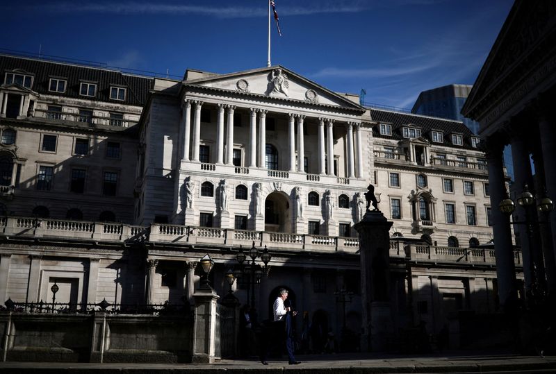 &copy; Reuters. FILE PHOTO: A person walks outside the Bank of England in the City of London financial district in London, Britain May 11, 2023. REUTERS/Henry Nicholls/File Photo